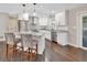 Modern kitchen with white cabinets, granite countertops, and stainless steel appliances at 3070 Grand Ave, Deland, FL 32720