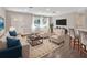 Spacious living room with hardwood floors and modern furniture at 3070 Grand Ave, Deland, FL 32720
