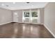 Hardwood floors and neutral color palette in this bright living room at 3070 Grand Ave, Deland, FL 32720