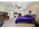 Relaxing main bedroom with ceiling fan and plush bedding at 310 Stakes Ct, Deland, FL 32724