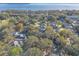 Community overview showcasing waterfront homes and lush trees at 32543 Crystal Breeze Ln, Leesburg, FL 34788