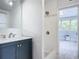 Modern bathroom with updated vanity and walk-in shower at 345 N Clara Ave, Deland, FL 32720