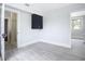 Bedroom with gray flooring and access to a bathroom at 345 N Clara Ave, Deland, FL 32720