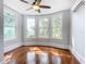 Bedroom with hardwood floors, bay window, and wall unit at 345 N Clara Ave, Deland, FL 32720