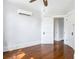 Bright bedroom with hardwood floors and ceiling fan at 345 N Clara Ave, Deland, FL 32720