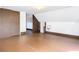 Spacious attic bedroom with hardwood floors and window at 345 N Clara Ave, Deland, FL 32720