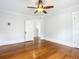 Hardwood floors, ceiling fan, and an open doorway leading to another room at 345 N Clara Ave, Deland, FL 32720