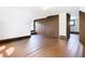 Large attic bedroom with dark hardwood floors and built-in closet at 345 N Clara Ave, Deland, FL 32720
