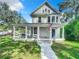 Two-story craftsman home with a large front porch and landscaped yard at 345 N Clara Ave, Deland, FL 32720