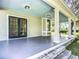 Spacious front porch with French doors and view of the yard at 345 N Clara Ave, Deland, FL 32720