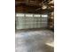 Spacious garage with overhead door and ample storage at 345 N Clara Ave, Deland, FL 32720