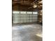 Spacious garage with overhead door and ample storage at 345 N Clara Ave, Deland, FL 32720