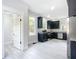 Modern kitchen with dark cabinetry, stainless steel appliances, and granite countertops at 345 N Clara Ave, Deland, FL 32720
