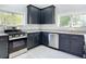Modern kitchen with stainless steel appliances and granite countertops at 345 N Clara Ave, Deland, FL 32720