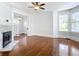 Living room with hardwood floors, fireplace, and French doors at 345 N Clara Ave, Deland, FL 32720
