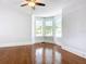 Living room with hardwood floors and bay window at 345 N Clara Ave, Deland, FL 32720