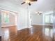 Bright and airy living room with hardwood floors and access to other rooms at 345 N Clara Ave, Deland, FL 32720