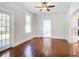 Living room with hardwood floors, French doors, and view of the backyard at 345 N Clara Ave, Deland, FL 32720