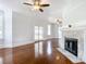 Living room with hardwood floors, fireplace, and French doors at 345 N Clara Ave, Deland, FL 32720