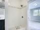 Clean and updated walk-in shower with mosaic tile at 345 N Clara Ave, Deland, FL 32720
