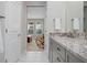 Modern bathroom with granite countertop, double sinks, and a walk-in shower at 3558 Nw 56Th Ave, Ocala, FL 34482