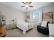 Cozy bedroom with a queen-size bed, nightstands, and a ceiling fan at 3558 Nw 56Th Ave, Ocala, FL 34482