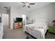 Bright bedroom with a king-size bed and views of the backyard at 3558 Nw 56Th Ave, Ocala, FL 34482