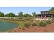Landscaped community space with seating overlooking a lake at 3558 Nw 56Th Ave, Ocala, FL 34482