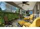 Relaxing covered patio with comfortable seating and ceiling fans at 3558 Nw 56Th Ave, Ocala, FL 34482