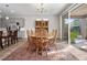 Bright dining room features a wood table with six chairs and access to the backyard at 3558 Nw 56Th Ave, Ocala, FL 34482