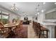 Bright dining room with hardwood floors and access to the patio at 3558 Nw 56Th Ave, Ocala, FL 34482
