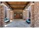 Inviting entryway with brick columns, wood accents, and comfortable seating at 3558 Nw 56Th Ave, Ocala, FL 34482