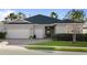 Beautiful one-story home with a two-car garage and landscaped lawn at 3558 Nw 56Th Ave, Ocala, FL 34482