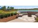 Brick fire pit with seating area overlooking the lake at 3558 Nw 56Th Ave, Ocala, FL 34482