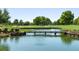 Picturesque golf course with a wooden bridge over a pond at 3558 Nw 56Th Ave, Ocala, FL 34482
