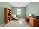 Bright home office features built-in shelving and a comfortable sitting area at 3558 Nw 56Th Ave, Ocala, FL 34482