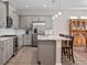 Modern kitchen with a large island and stainless steel appliances at 3558 Nw 56Th Ave, Ocala, FL 34482