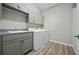 Modern laundry room with washer, dryer, and ample storage at 3558 Nw 56Th Ave, Ocala, FL 34482