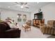 Relaxing living room with comfortable seating and a large TV at 3558 Nw 56Th Ave, Ocala, FL 34482