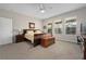 Spacious main bedroom with a large bed, plenty of natural light, and an en-suite bathroom at 3558 Nw 56Th Ave, Ocala, FL 34482