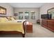 Bright bedroom with a king-size bed and en-suite bathroom access at 3558 Nw 56Th Ave, Ocala, FL 34482