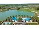 Aerial view showing pool, lake, and surrounding landscape at 3558 Nw 56Th Ave, Ocala, FL 34482