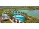 Aerial view of resort-style pool with palm trees and cabanas at 3558 Nw 56Th Ave, Ocala, FL 34482