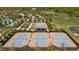 Aerial view of three tennis courts and surrounding area at 3558 Nw 56Th Ave, Ocala, FL 34482