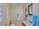 Full bathroom with toilet, sink, and laundry access at 365 Fletcher Ave, Daytona Beach, FL 32114