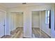 Bedroom with mirrored closet doors and wood-look floors at 365 Fletcher Ave, Daytona Beach, FL 32114