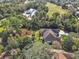 House and surrounding area viewed from above, near golf course at 376 Hampton Hills Ct, Debary, FL 32713