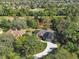 Aerial perspective showcasing home's location near golf course at 376 Hampton Hills Ct, Debary, FL 32713