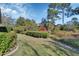 Landscaped backyard with lush greenery and mature trees at 376 Hampton Hills Ct, Debary, FL 32713