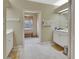 Clean bathroom with double vanity, and access to a shower at 376 Hampton Hills Ct, Debary, FL 32713